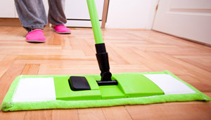 A young woman cleaning and doing housework